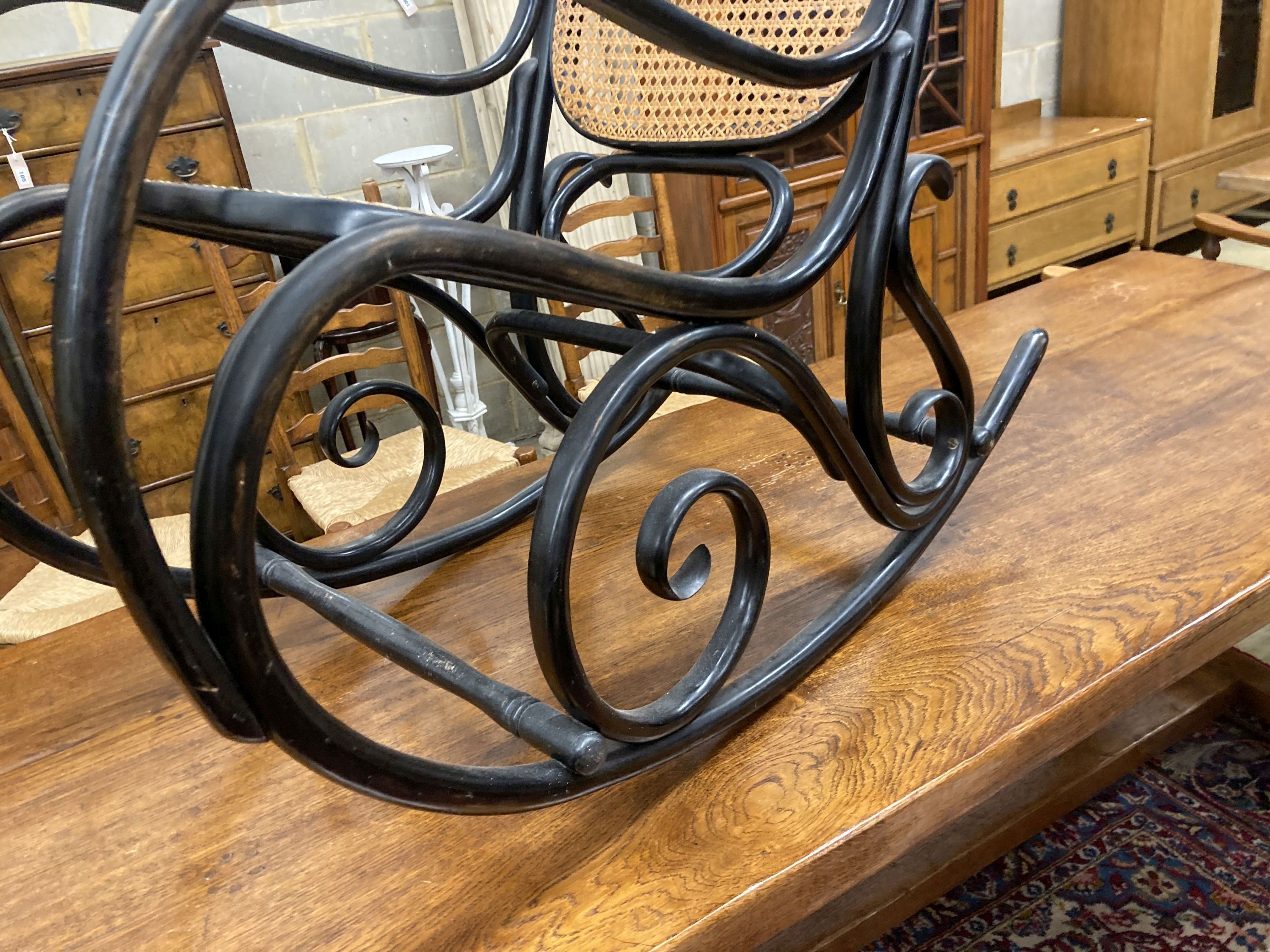 A Habitat 1970s ebonised bentwood caned rocking chair, width 50cm, depth 106cm, height 107cm